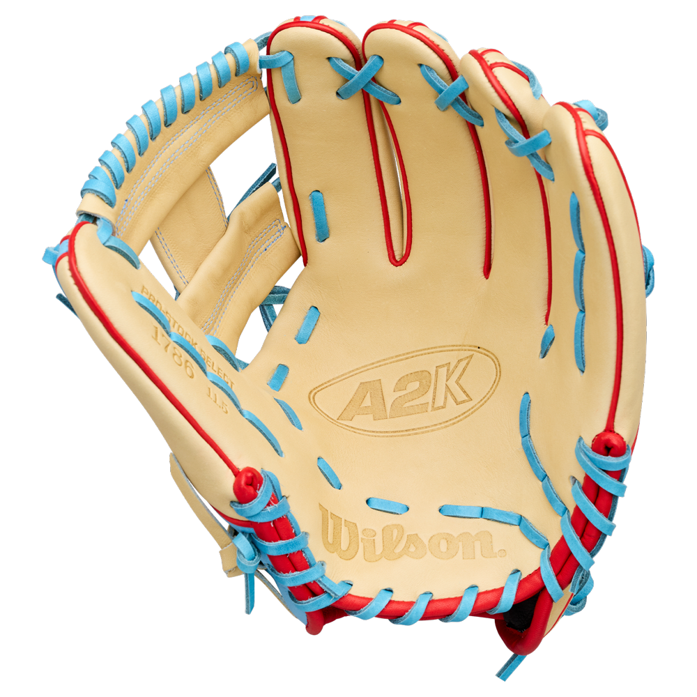 A Wilson A2K 1786 11.5″ Baseball Glove (WBG0010101RT115) from Wilson, crafted from premium Pro Stock Select leather in a tan color and accented with red and blue lacing, is displayed palm-up against a plain white background to showcase its elite quality as an infield glove.