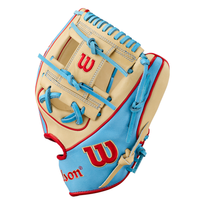 The Wilson A2K 1786 11.5″ Baseball Glove (model WBG0010101RT115) by Wilson is shown on a white background, featuring a tan and light blue color scheme with red stitching and accents. This infield glove is crafted from Pro Stock Select leather and displays a red “W” on the wrist strap and back of the glove.