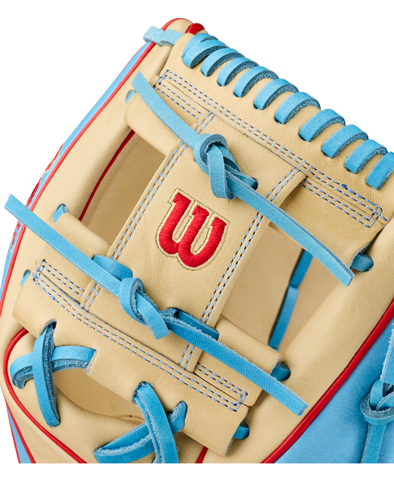 Close-up of the Wilson A2K 1786 11.5″ Baseball Glove (WBG0010101RT115) in beige and light blue with red accents, featuring a red Wilson “W” logo stitched on its premium Pro Stock Select leather, designed for infield play.