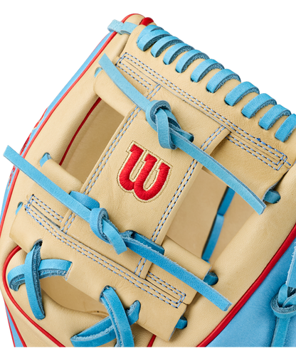 Close-up of the Wilson A2K 1786 11.5″ Baseball Glove (WBG0010101RT115) in beige and light blue with red accents, featuring a red Wilson “W” logo stitched on its premium Pro Stock Select leather, designed for infield play.