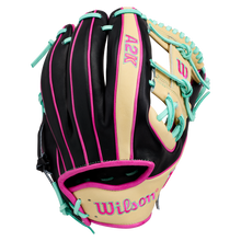The Wilson A2K 1724 11.75″ Baseball Glove (WBG0010201RT1175) by Wilson features a striking design with black, tan, teal, and pink accents. The infield glove showcases the Wilson logo and visible stitching, along with teal laces and a pink outline. For enhanced stability, it includes Double Palm Construction.