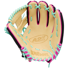 The Wilson A2K 1724 11.75″ Baseball Glove: WBG0010201RT1175 by Wilson features a tan design with black trim and pink and teal laces. Displayed open with the palm facing forward, this glove showcases its Double Palm Construction for enhanced durability, making it an ideal choice for infielders.