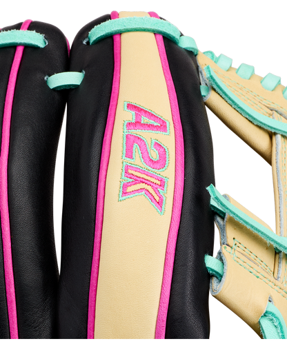 Close-up of a Wilson A2K 1724 11.75″ Baseball Glove (WBG0010201RT1175) by Wilson, specially crafted for infielders, displaying “A2K” embroidered in pink and blue on a tan leather section. The image emphasizes the Double Palm Construction as well as the glove’s black, teal, and pink accents.