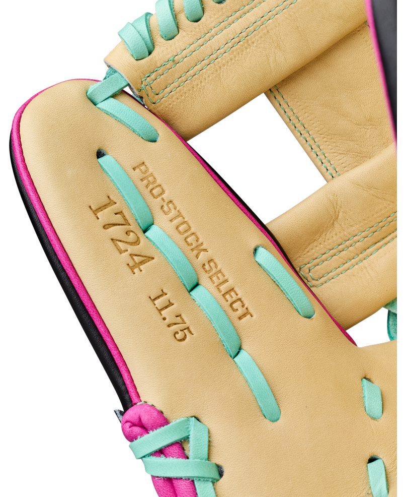 Close-up of a Wilson A2K 1724 11.75″ Baseball Glove: WBG0010201RT1175 in tan with teal and pink laces, featuring PRO STOCK SELECT 1724 11.75 embossed in the leather. This Wilson infielder’s glove offers Double Palm Construction for enhanced stability and a premium feel.