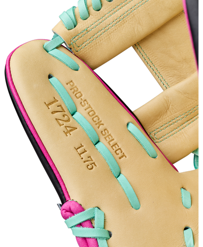 Close-up of a Wilson A2K 1724 11.75″ Baseball Glove: WBG0010201RT1175 in tan with teal and pink laces, featuring PRO STOCK SELECT 1724 11.75 embossed in the leather. This Wilson infielder’s glove offers Double Palm Construction for enhanced stability and a premium feel.