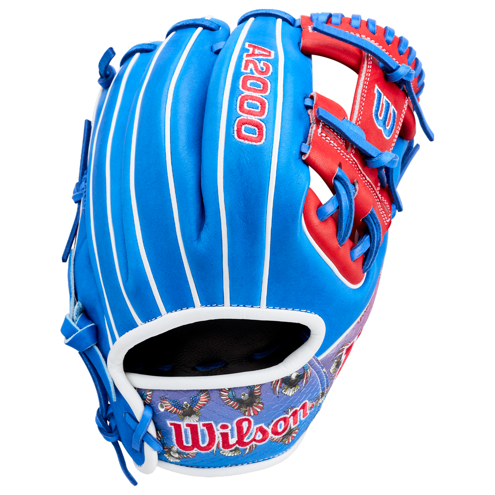 The Wilson A2000 1786SS 11.5" Baseball Glove (GOTM July 2026) features Pro Stock leather in blue, red, and white with decorative lower palm patterns and bold red lacing.