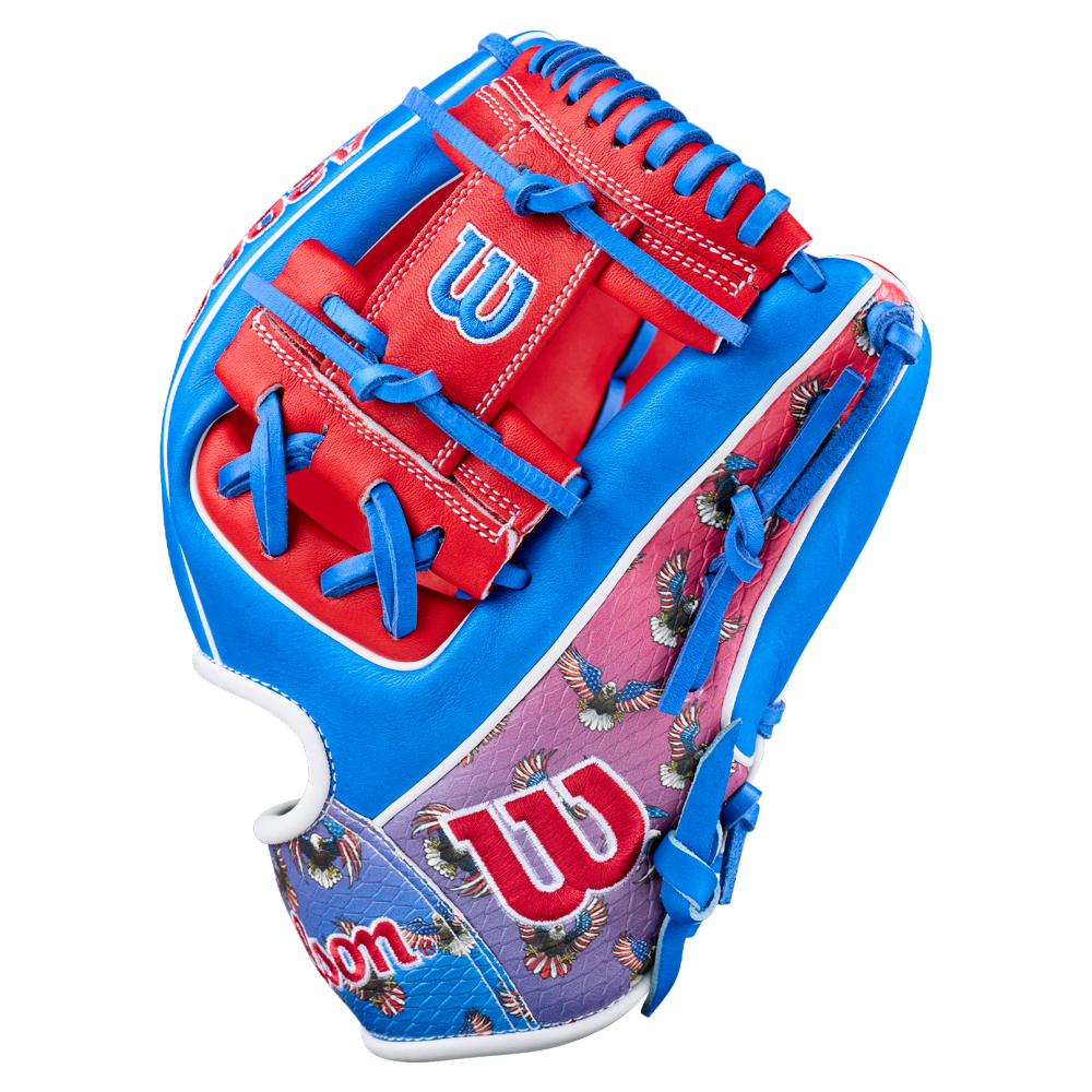 The Wilson A2000 1786SS 11.5" Baseball Glove (GOTM July 2026) features bright blue, red, and purple accents, Pro Stock leather, the Wilson logo, and an eagle pattern on the purple section near the wrist.