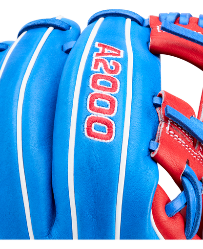 Close-up of the Wilson A2000 1786SS 11.5" Baseball Glove (GOTM July 2026), crafted with Pro Stock leather in blue with red and white accents, featuring detailed stitching and "A2000" embroidered on the back.