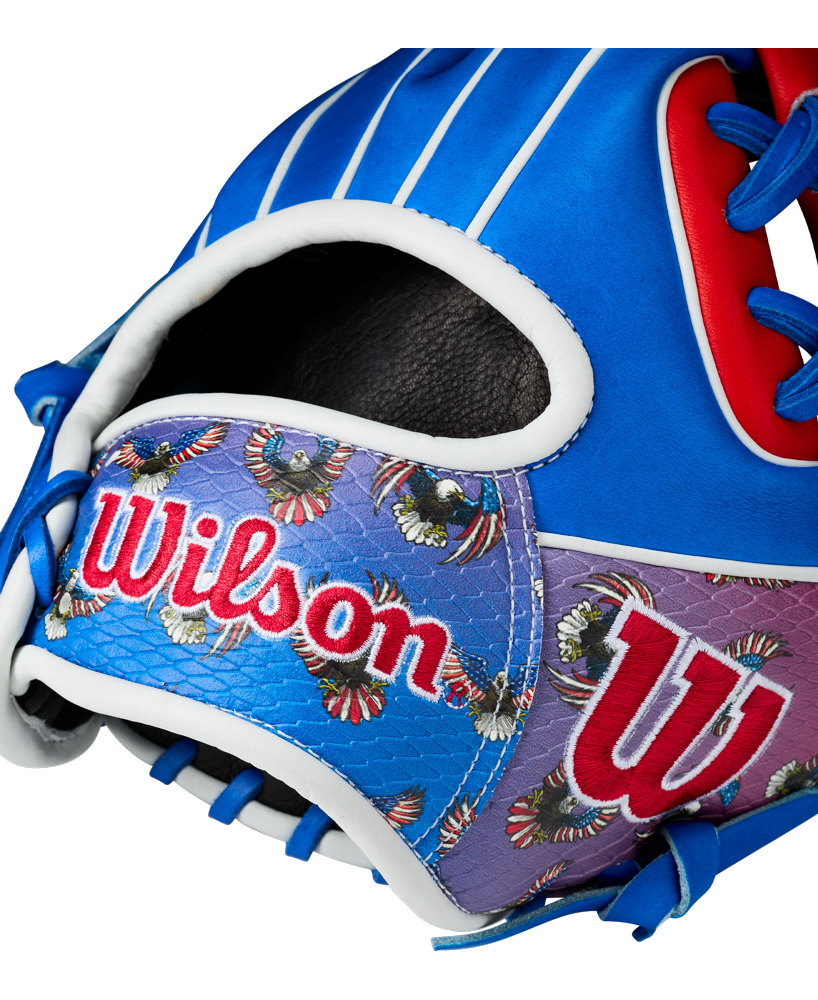 Close-up of the Wilson A2000 1786SS 11.5" Baseball Glove (GOTM July 2026), featuring blue, red, and purple Pro Stock leather with intricate stitching, colorful embroidered patterns, and the Wilson logo displayed prominently.