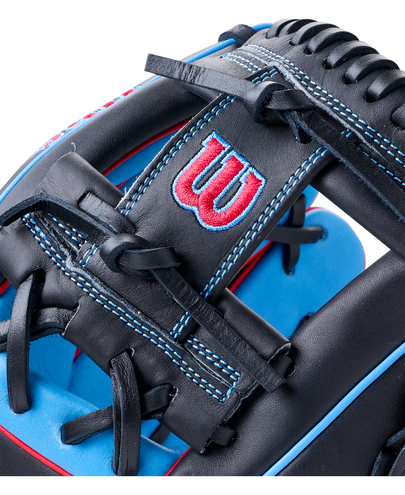 Close-up of a black Wilson A1000 DP15 11.5″ Baseball Glove with blue accents and stitching, featuring a red and blue logo on the wrist strap designed for smaller hands.