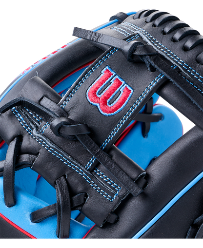 Close-up of a black Wilson A1000 DP15 11.5″ Baseball Glove with blue accents and stitching, featuring a red and blue logo on the wrist strap designed for smaller hands.
