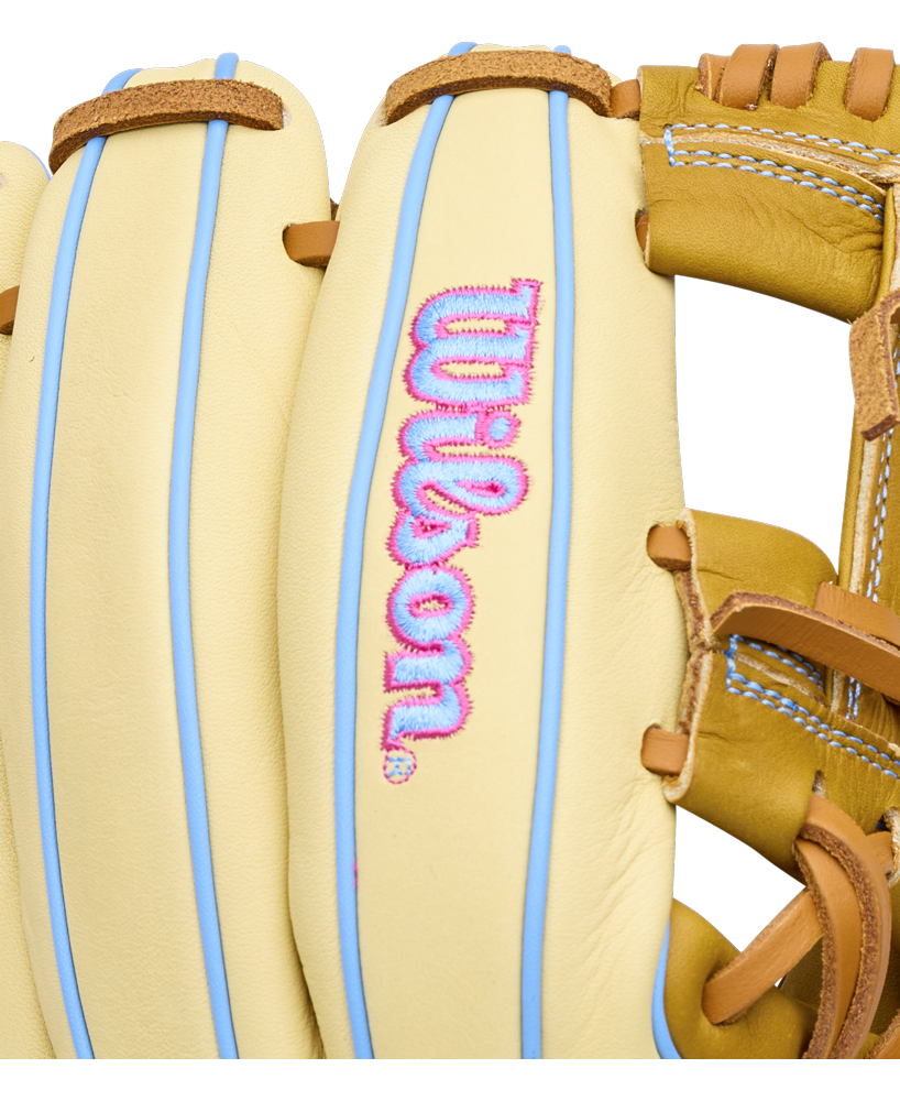 Wilson A1000 1786 11.5″ Baseball Glove in tan with light blue piping and pink and blue embroidered lettering on the palm.