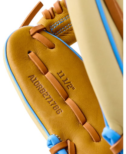 Close-up of the interior palm of an 11.5″ Wilson A1000 1786 11.5″ Baseball Glove: WBG02501RT1786, showing stamped model information and lacing details.
