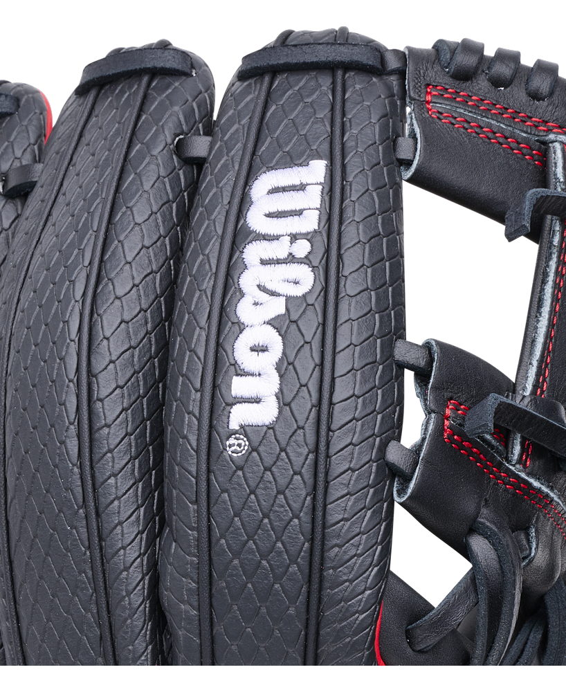 Close-up of a black Wilson A1000 1975SS 11.75″ Baseball Glove with a textured, scale-like pattern and red stitching along the seams.