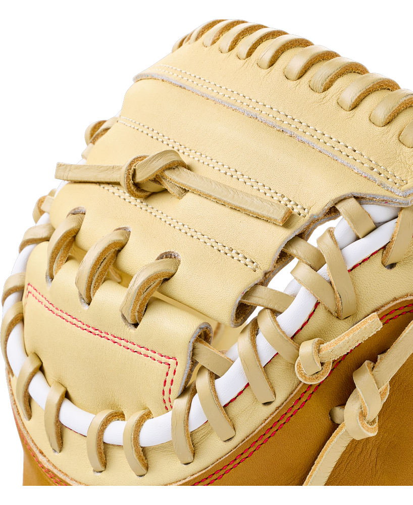 Close-up of a tan Wilson A1000 PF33 33″ Baseball Catcher’s Mitt: WBG03001RTPF33 with thick white lacing.