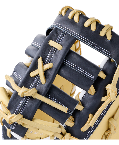 Close-up of a 12″ navy blue Wilson A1000 PF1612 12″ Baseball First Base Mitt with tan full grain leather lacing.