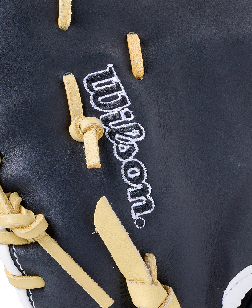 Close-up of a Wilson A1000 PF1612 12″ Baseball First Base Mitt, featuring black leather, light-colored laces, and white embroidered branding.