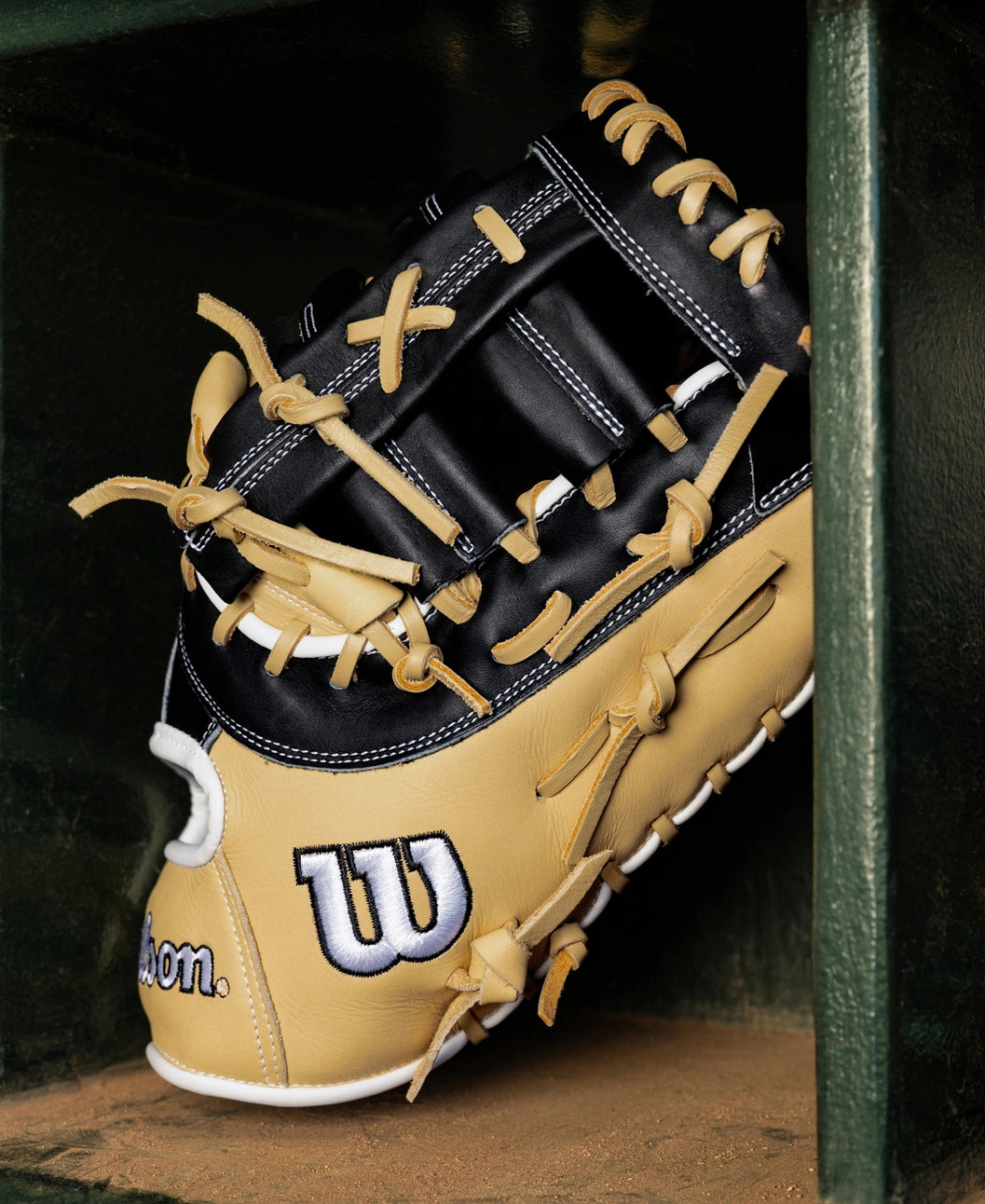 Wilson A1000 PF1612 12″ Baseball First Base Mitt, a 12.5″ black and tan mitt crafted from full grain leather with tan lacing.