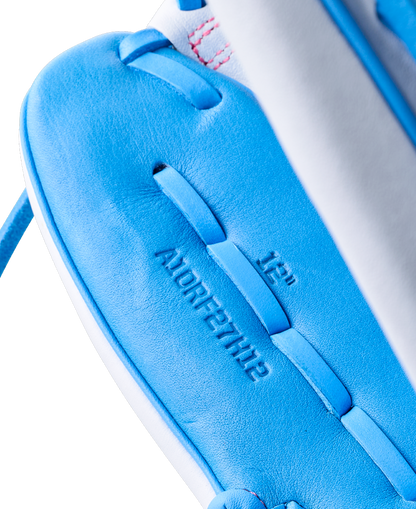 Close-up of a blue and white Wilson A1000 H12 12″ Fastpitch Glove embossed with the text A10RF27H12 and 12.