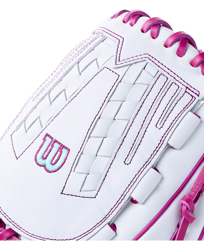 Close-up of a white Wilson A1000 V125 12.5″ Fastpitch Glove: WBG03601RTV125 featuring bright pink lacing and stitching.