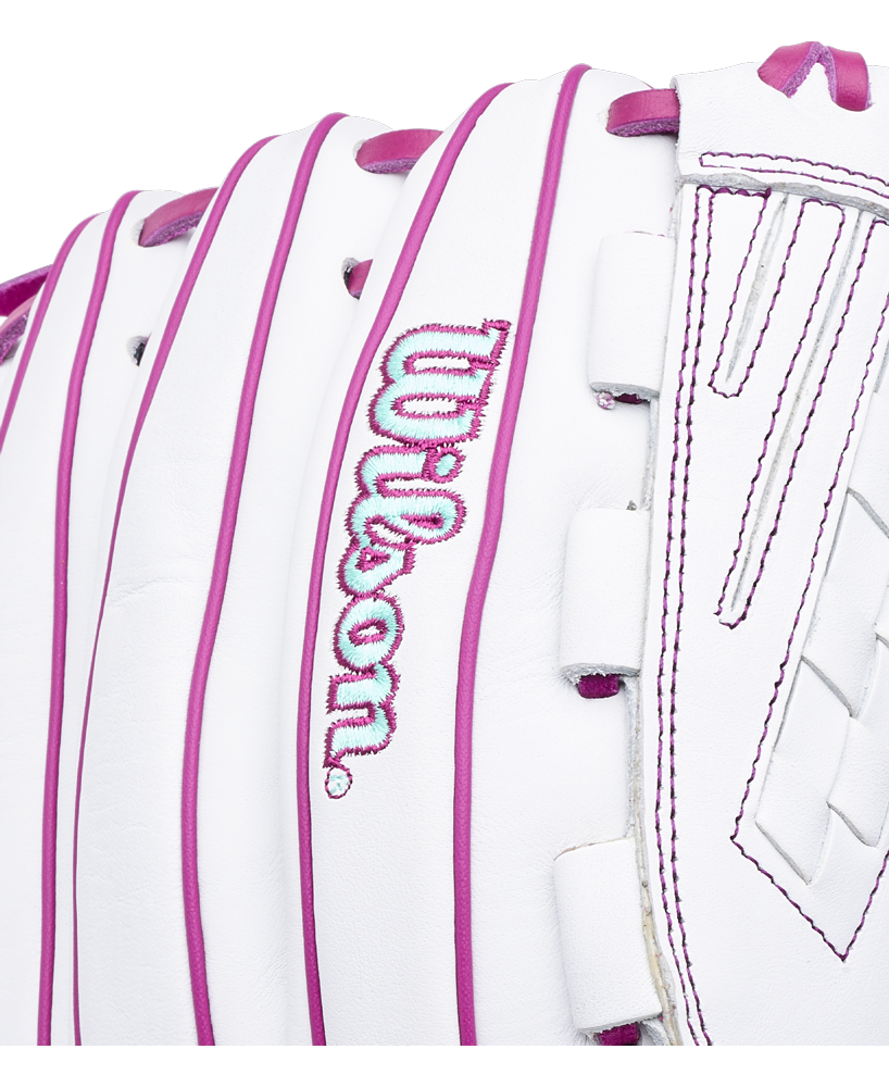 Wilson A1000 V125 12.5″ Fastpitch Glove in white with pink lacing and stitching, featuring the brand name embroidered in pink and blue.