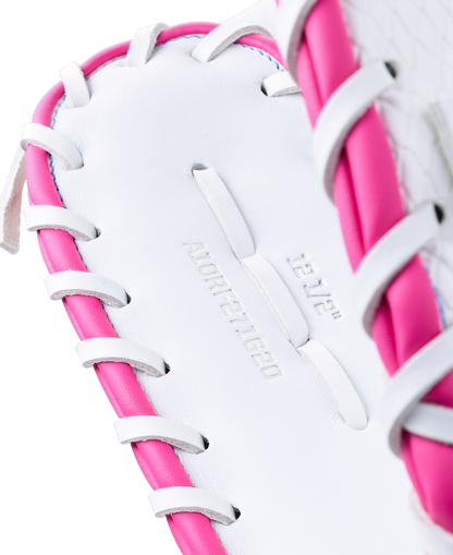 Close-up of a white Wilson A1000 FP1620SS 12.5″ Fastpitch First Base Mitt with pink lacing, embossed with 12 1/2 and A10RF271620.