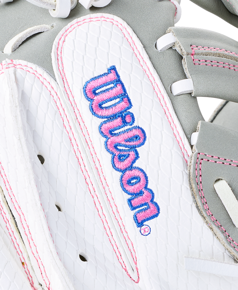 Close-up of a white and gray Wilson A1000 FPCM33 33″ Fastpitch Catcher’s Mitt with pink stitching and the brand name embroidered in blue and pink.