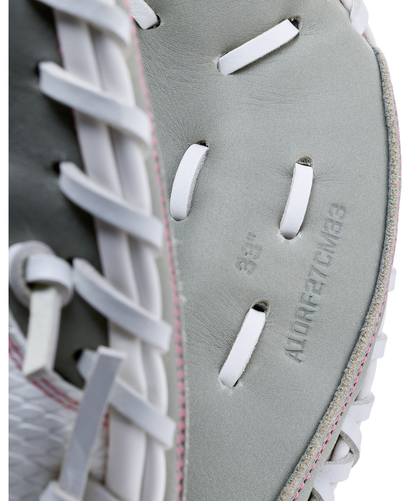Close-up of a grey Wilson A1000 FPCM33 33″ Fastpitch Catcher’s Mitt with white lacing, featuring stamped text reading 33 inch and A10RF27CM33.