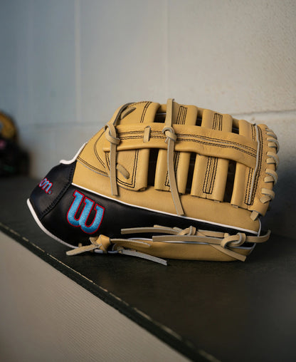 A tan and black Wilson A700 12.5″ Baseball Glove: WBG04601RT125 with a blue and red logo on the wrist strap.