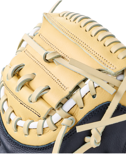 Close-up of a tan and black Wilson A700 32.5″ Baseball Catcher’s Mitt: WBG04701RT325 made from full grain leather, featuring white lacing.