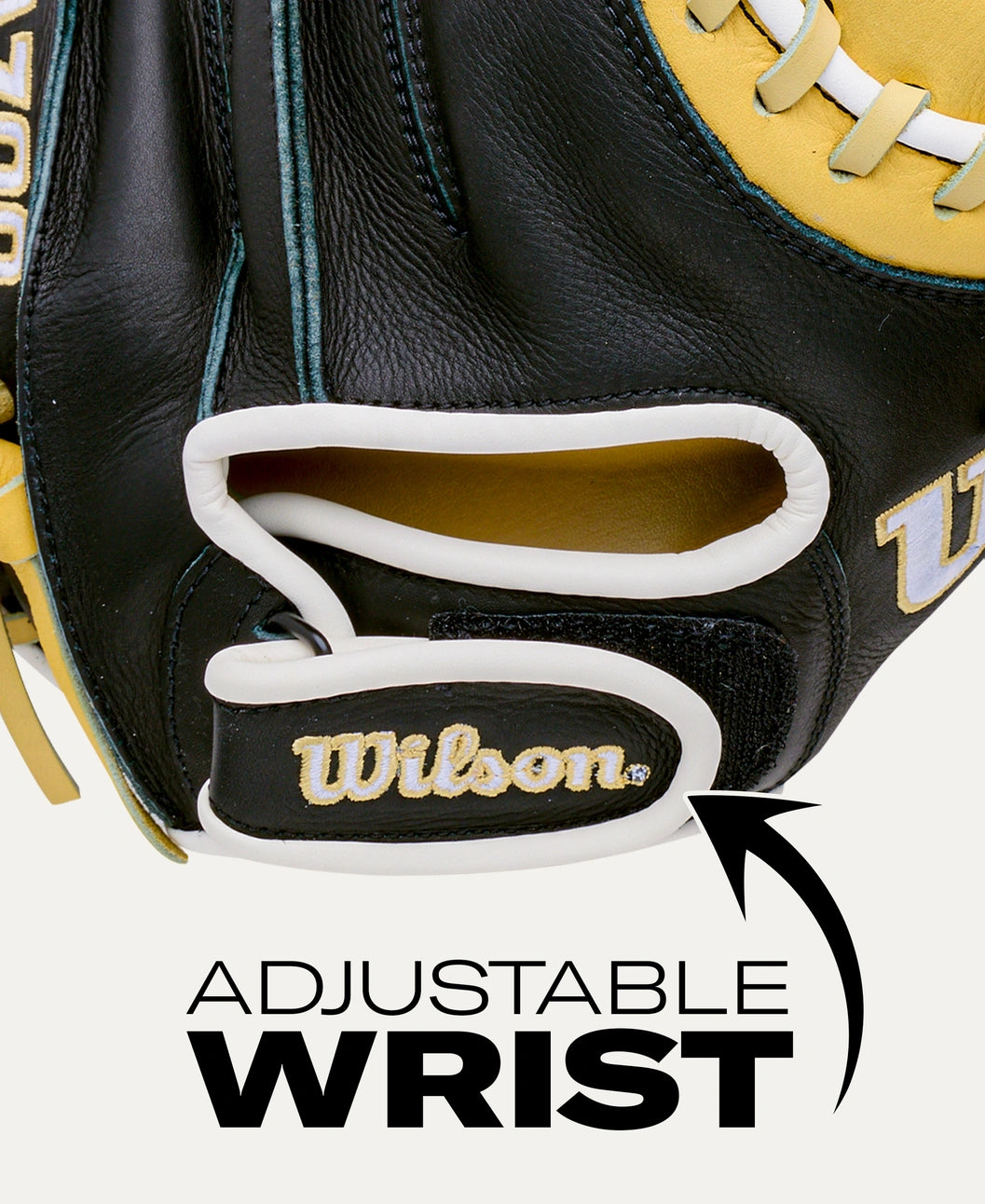 Close-up of a black and yellow Wilson A700 32.5″ Baseball Catcher’s Mitt: WBG04701RT325 featuring an adjustable wrist strap with a hook-and-loop closure.
