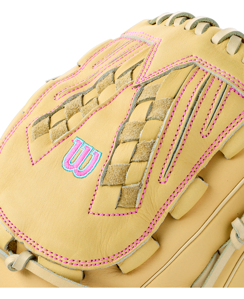Close-up of a tan Wilson A700 12.5″ Fastpitch Glove: WBG05001RT125 with bright pink stitching and a blue and pink embroidered logo on the back.