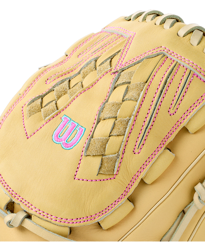 Close-up of a tan Wilson A700 12.5″ Fastpitch Glove: WBG05001RT125 with bright pink stitching and a blue and pink embroidered logo on the back.