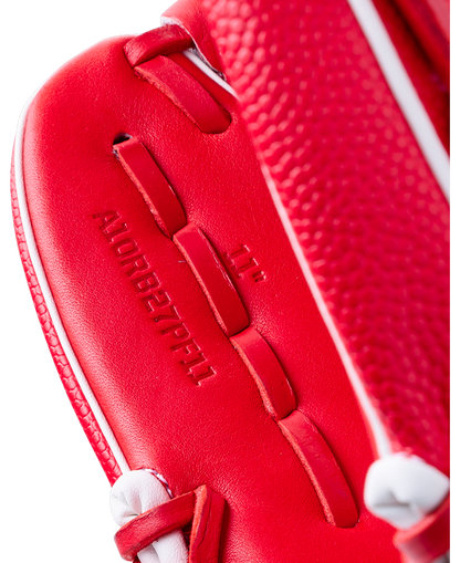 Close-up of a red Wilson A1000 PF11SS 11″ Baseball Glove showing the text A10RB27PF11 and 11 embossed on the palm.
