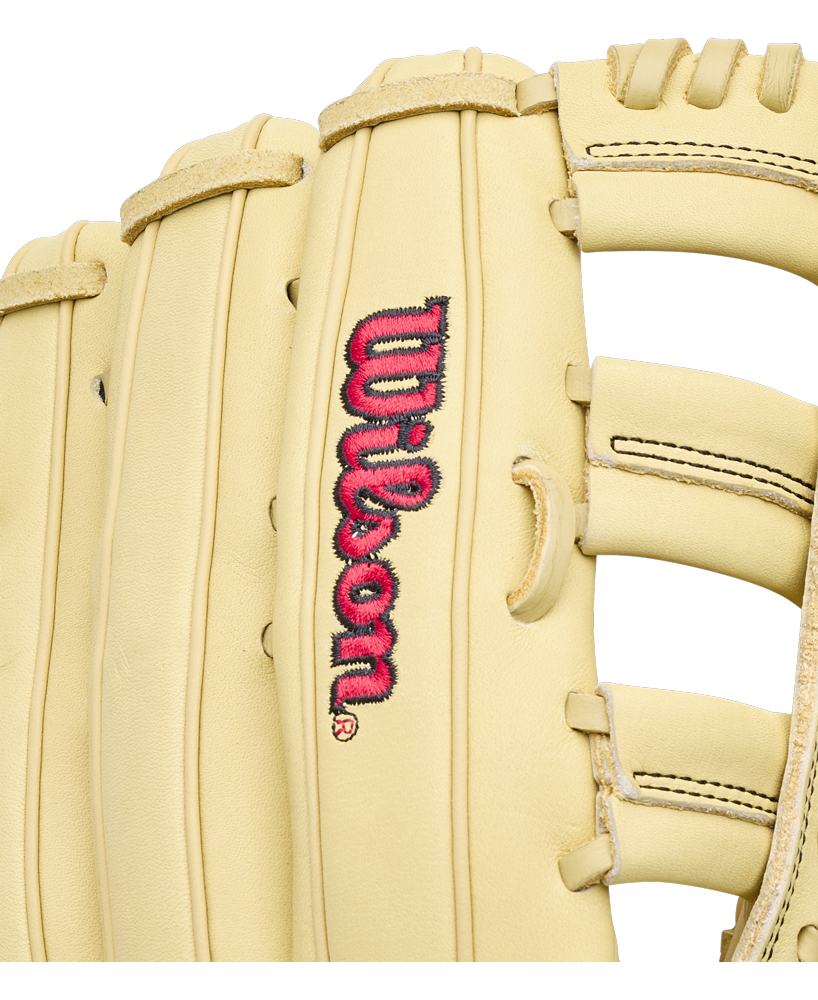 Close-up of a light tan Wilson A1000 1892 12.25″ Baseball Glove: WBG05301RT1225, featuring an embroidered logo in pink and black lettering.