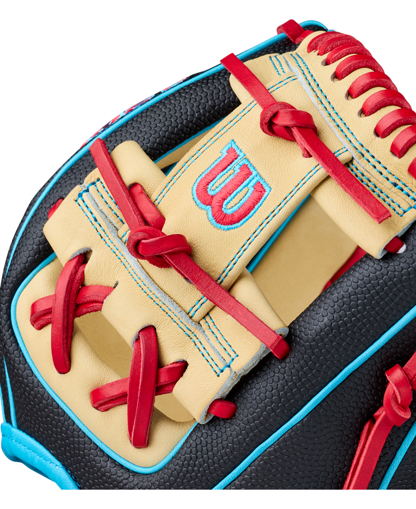 Close-up of a Wilson A2000 DP15SS 11.5″ Baseball Glove (WBG05501RT115) showcasing beige, black, and blue leather with red laces and stitching. This Pedroia Fit glove features a red and blue Wilson “W” logo embroidered on the beige section.