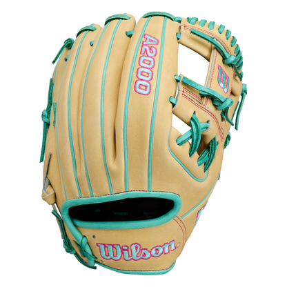 A tan baseball glove with teal lacing and pink lettering. This A2000 1975 features an extra deep pocket and measures as an 11.75” infield glove, with Wilson printed on it, plus teal accents outlining the edges and stitching details.