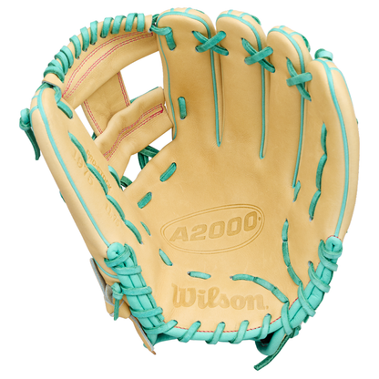 A tan Wilson A2000 1975 baseball glove with teal laces and A2000 embossed on the palm, featuring an extra deep pocket, displayed open with visible stitching.