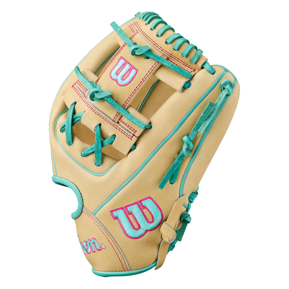 The Wilson A2000 1975 11.75″ Baseball Glove (WBG05701RT1175) by Wilson features a beige design with teal laces and pink accents, including pink stitching and pink W logos on the wrist and thumb areas.