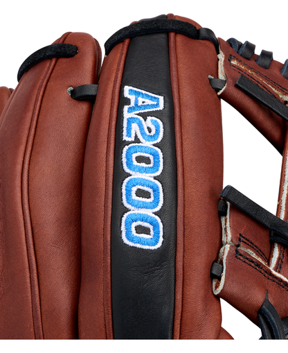 Close-up of the Wilson A2000 BWJ7GM 11.75″ Bobby Witt Jr. GM Baseball Glove (WBG05801RT1175), featuring rich brown leather, black trim, and white-blue “A2000” embroidery on one of its fingers—a design inspired by the model used by Bobby Witt Jr.