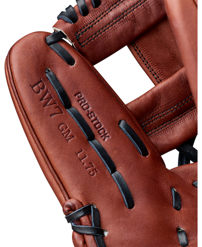 Close-up of a brown leather Wilson A2000 BWJ7GM 11.75″ Bobby Witt Jr. GM Baseball Glove (WBG05801RT1175) featuring black laces and Wilson branding, with “BWJ7GM,” “PRO STOCK,” “GM,” and “11.75” stamped on the leather to showcase its design as Bobby Witt Jr.’s signature glove.
