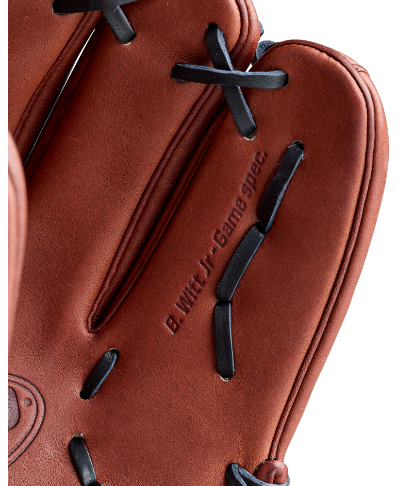 A close-up of a brown Wilson A2000 BWJ7GM 11.75″ Bobby Witt Jr. GM Baseball Glove (WBG05801RT1175) featuring black laces and “B. Witt Jr. Game Spec.” embossed on it, made by Wilson and modeled after Bobby Witt Jr.’s game glove.