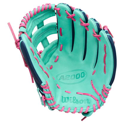 A mint green Wilson A2000 1750SS 12.5″ Baseball Glove (WBG05901RT125) featuring pink laces and blue accents, open and facing upward—ideal as an outfield glove with a dependable Flex Insert for enhanced performance.