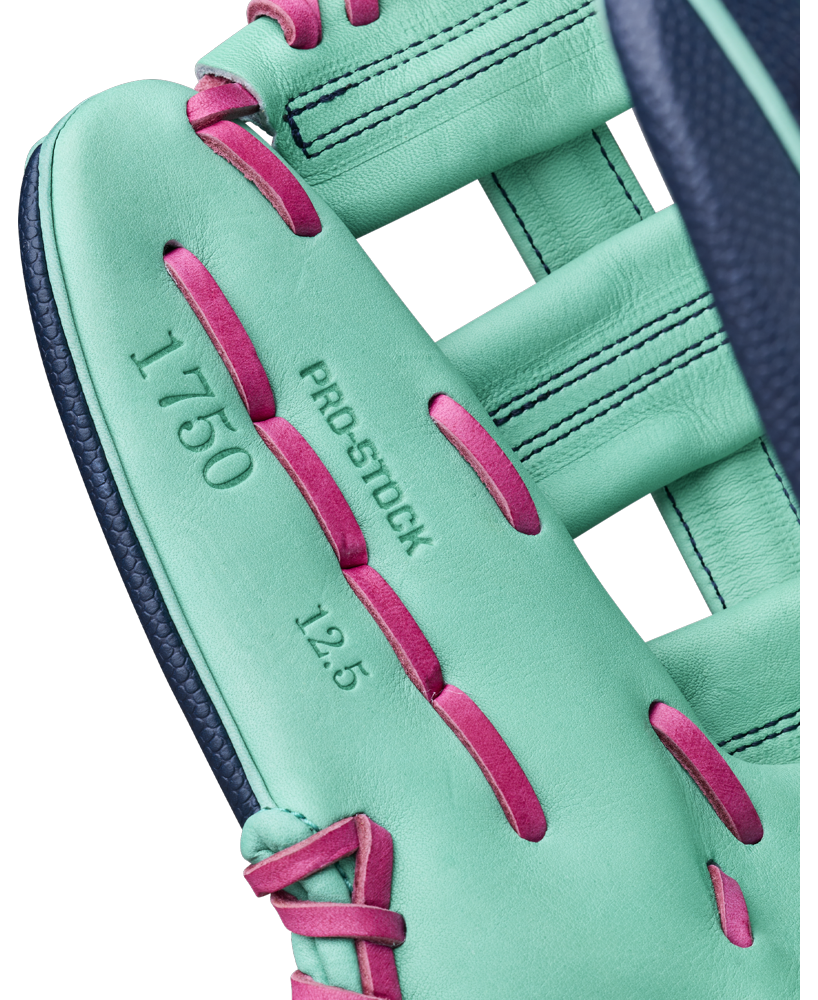 Close-up of the Wilson A2000 1750SS 12.5″ Baseball Glove by Wilson, featuring a turquoise color with pink laces and displaying the text “1750,” “PRO STOCK,” and “12.5” on the inside.