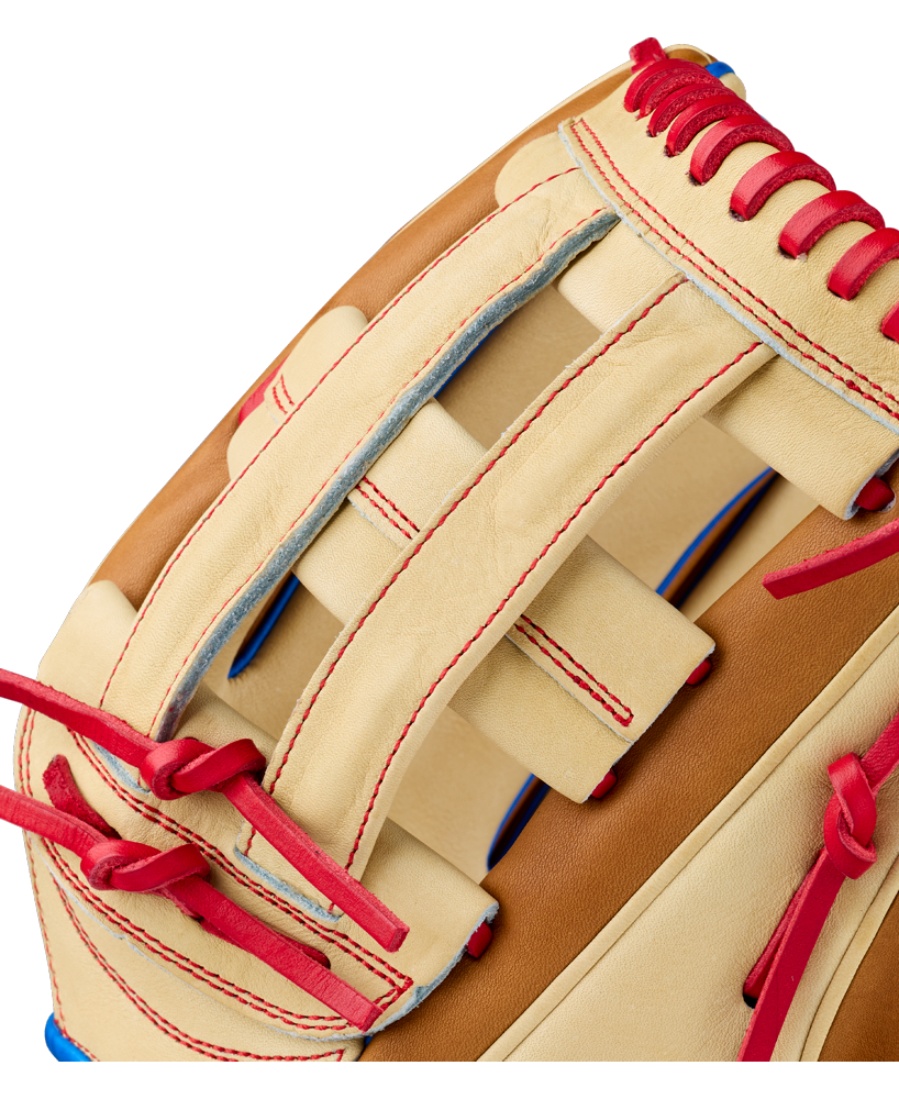 Close-up of the Wilson A2000 1777 12.75″ Baseball Glove (WBG06001RT1275) by Wilson, featuring a tan design with red laces, red stitching, and blue accents that highlight the exceptional craftsmanship and detailed texture of its Pro Stock leather construction, making it a premium choice for outfielders.