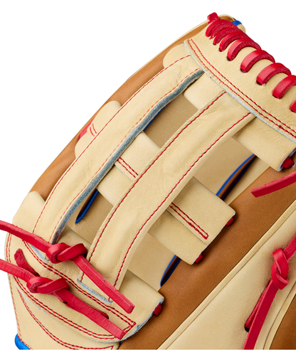Close-up of the Wilson A2000 1777 12.75″ Baseball Glove (WBG06001RT1275) by Wilson, featuring a tan design with red laces, red stitching, and blue accents that highlight the exceptional craftsmanship and detailed texture of its Pro Stock leather construction, making it a premium choice for outfielders.