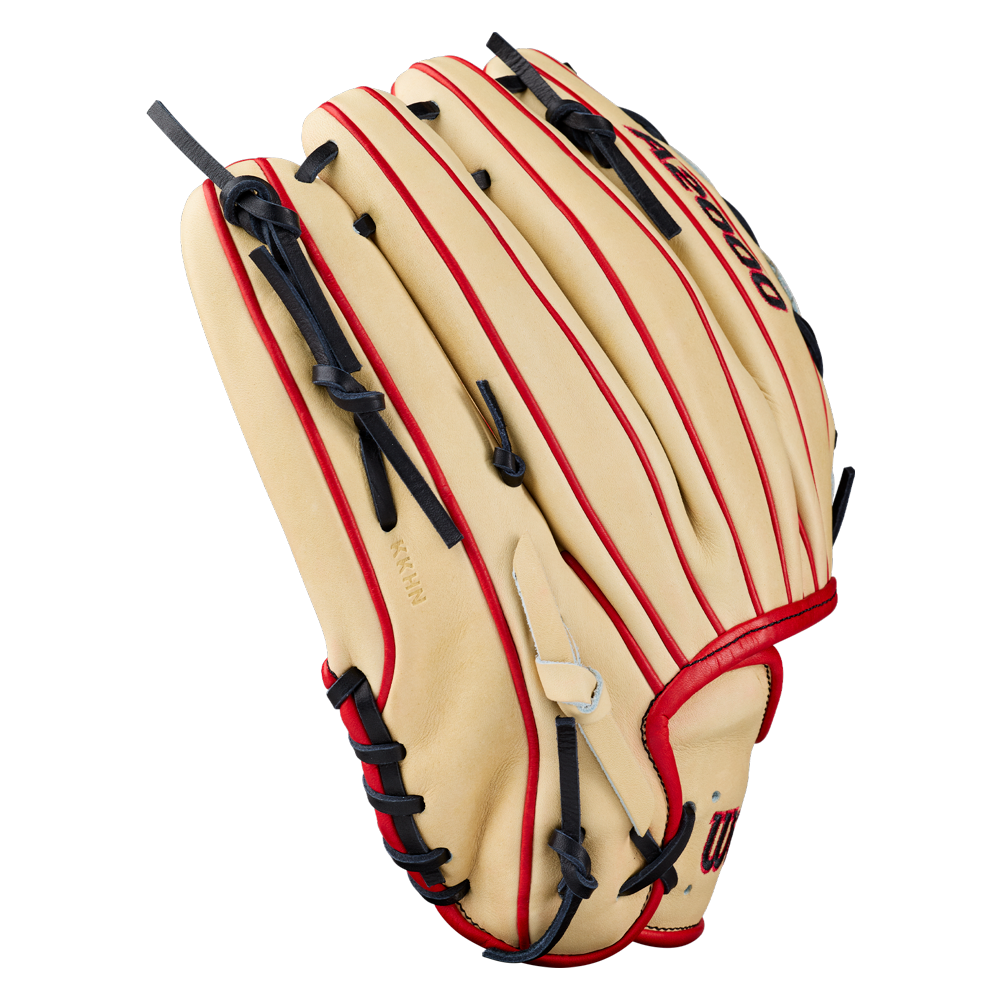 A Wilson A2000 DH12 12″ baseball glove by Wilson, featuring premium Pro Stock leather in tan, accented with red and black laces. The glove is positioned upright to highlight its meticulous stitching and distinctive Dual Hinge Web design.