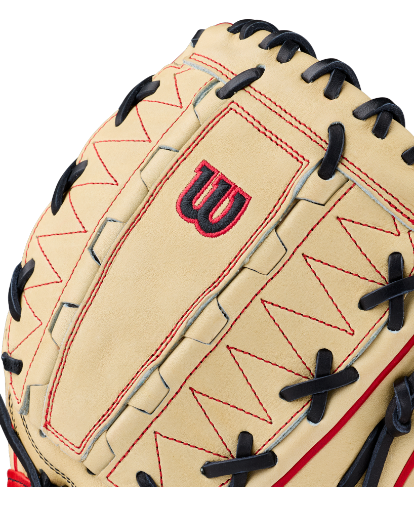 Close-up of the Wilson A2000 DH12 12″ Baseball Glove (WBG06101RT12) by Wilson, showcasing a tan leather construction with black laces, red stitching, and an embroidered red and black W logo. Crafted from premium Pro Stock leather, this glove features a Dual Hinge Web design ideal for pitchers.