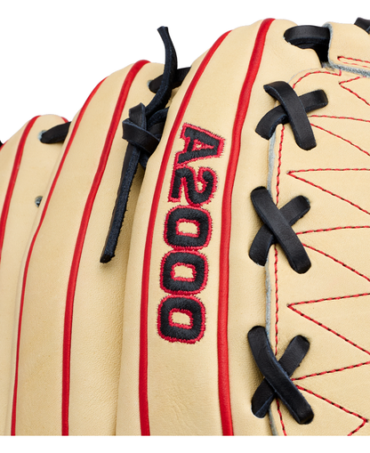 Close-up of the Wilson A2000 DH12 12″ Baseball Glove: WBG06101RT12, crafted from Pro Stock leather in tan with red stitching and black laces. The text “A2000” is embroidered in red and black on the glove, which features a distinctive Dual Hinge Web for added performance.