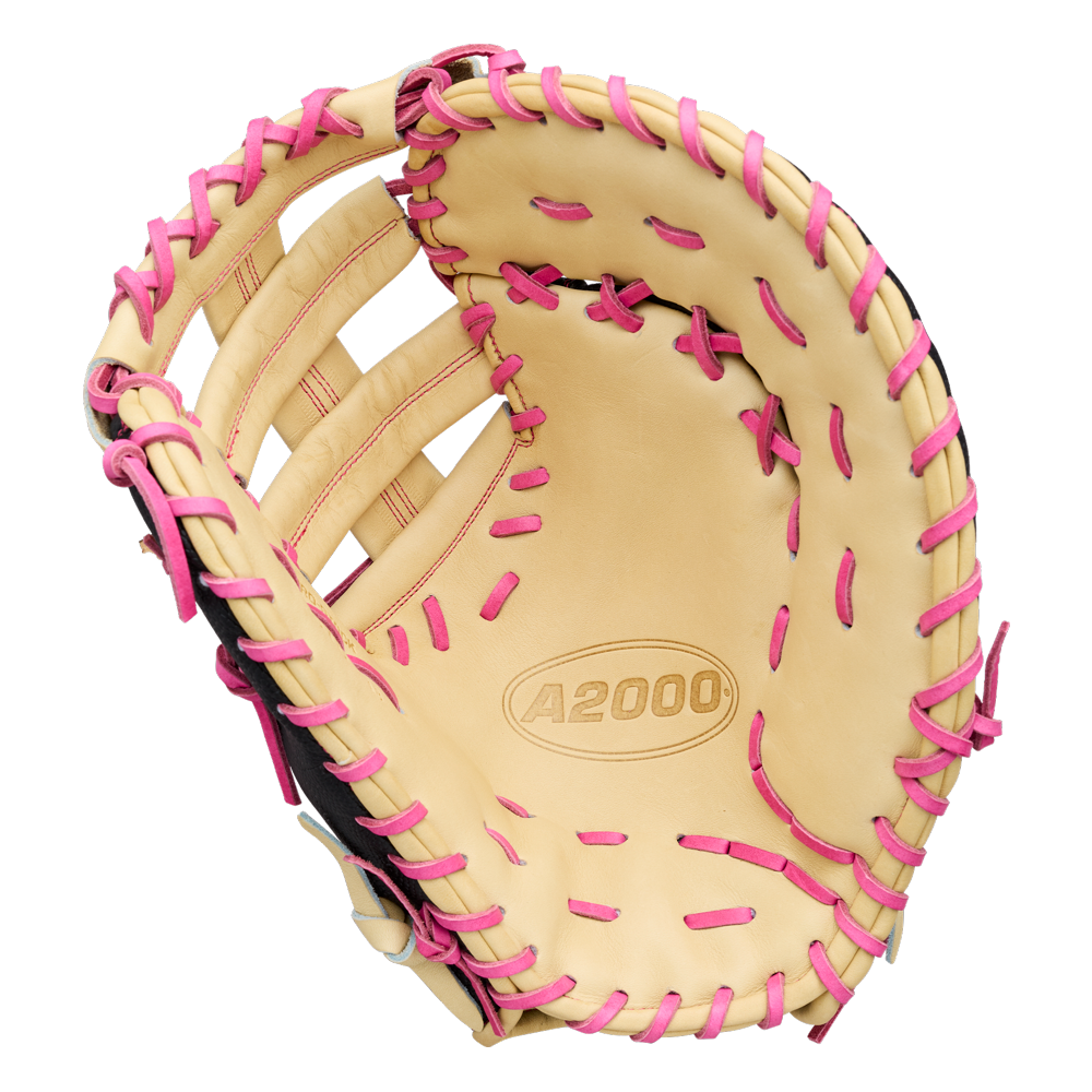 Wilson A2000 1673SS 13″ Baseball First Base Mitt (WBG06301RT13) by Wilson, featuring a tan design with pink lacing and the iconic Wilson A2000 logo on the palm—shown open to highlight its interior and webbing, delivering standout style for first basemen.
